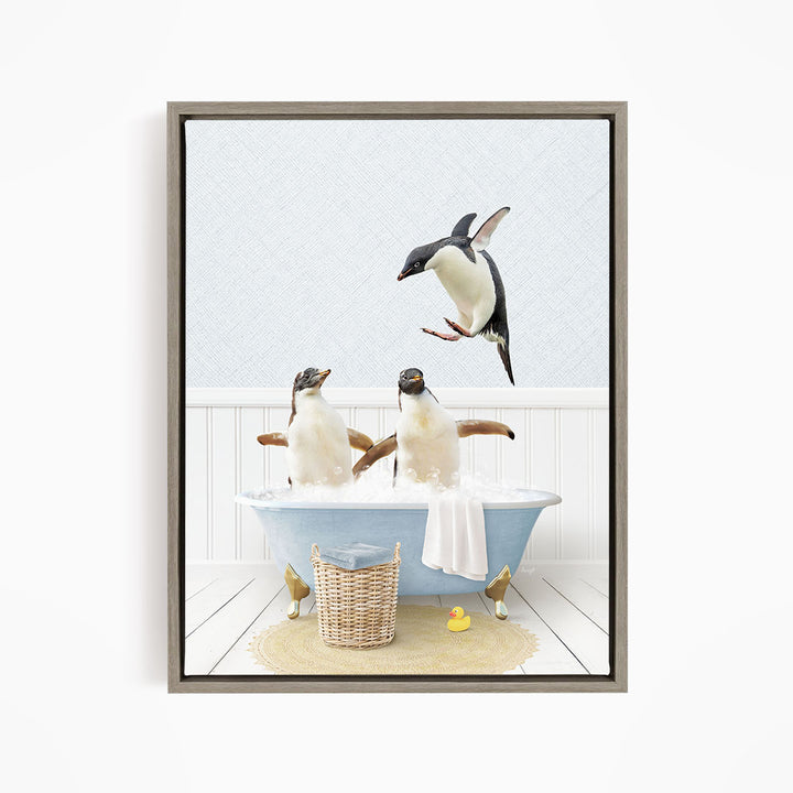 A framed image depicting two penguins sitting in a bathtub, with one penguin flying towards the other penguin.