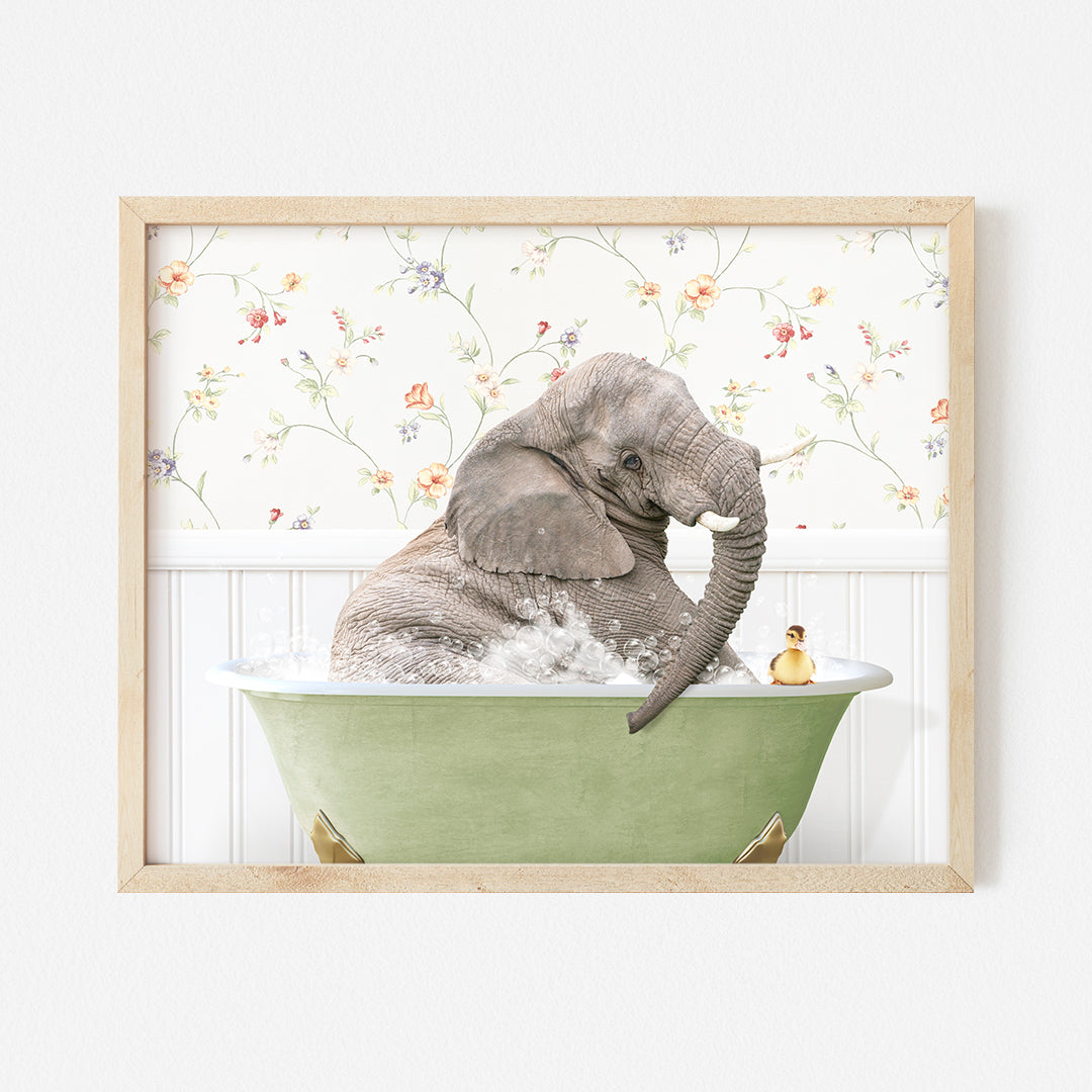 an elephant taking a bath in a green bathtub