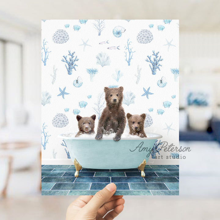 a person holding up a card with three bears in a bathtub