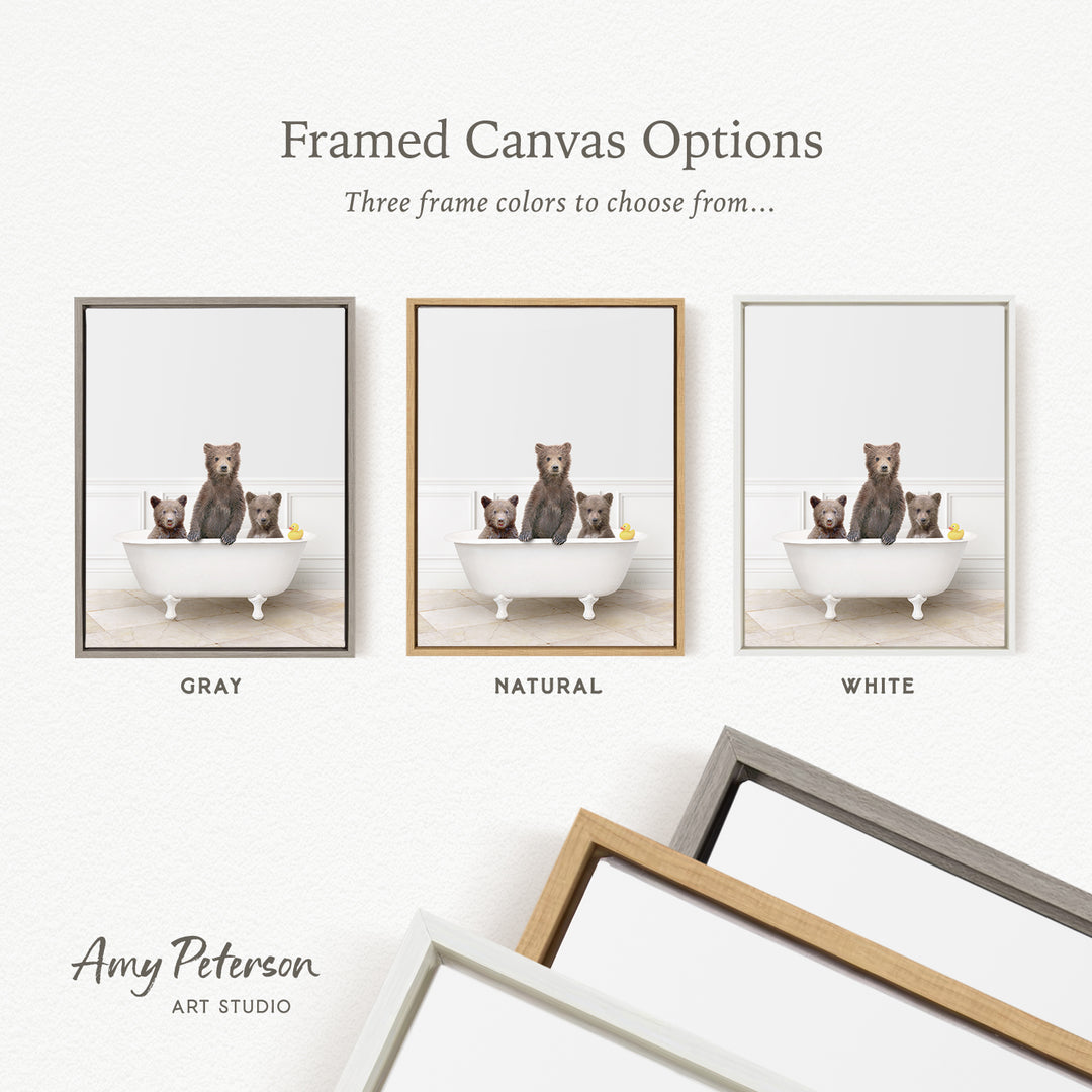 three framed canvas options, each featuring a bear sitting in a bathtub. The options include a gray frame, a natural frame, and a white frame. The bears are depicted in different colors, with one bear in each frame.