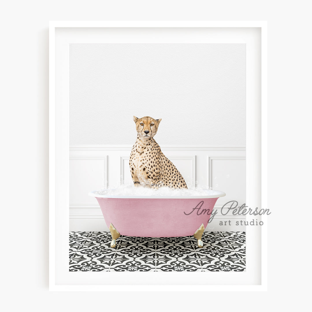 a cheetah sitting in a pink bath tub