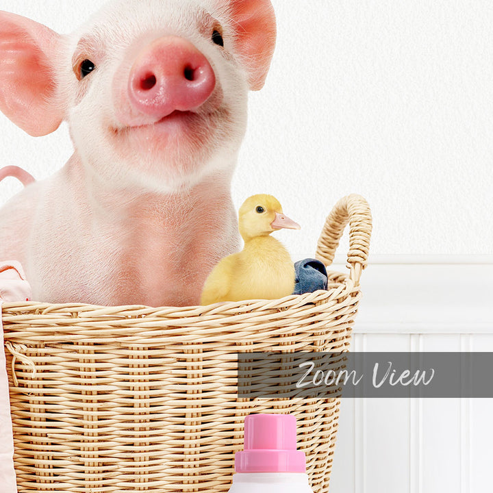 A pink pig sits in a wicker basket, accompanied by a yellow duckling, with a pink bottle and a white wall in the background.