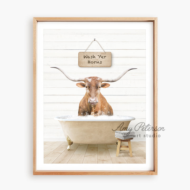 a cow is sitting in a bathtub with a sign above it