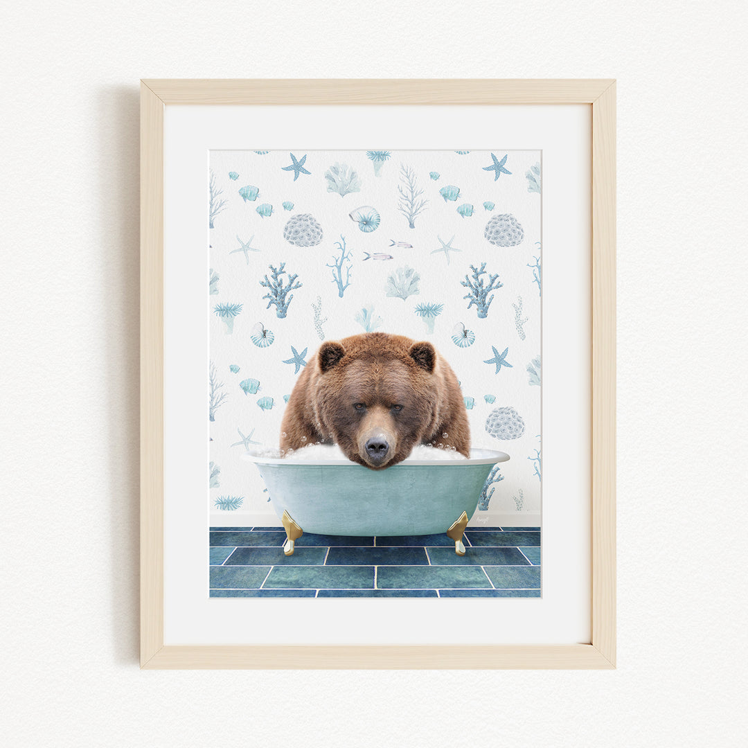 A brown bear is sitting in a bathtub filled with water, surrounded by a blue and white patterned wall.