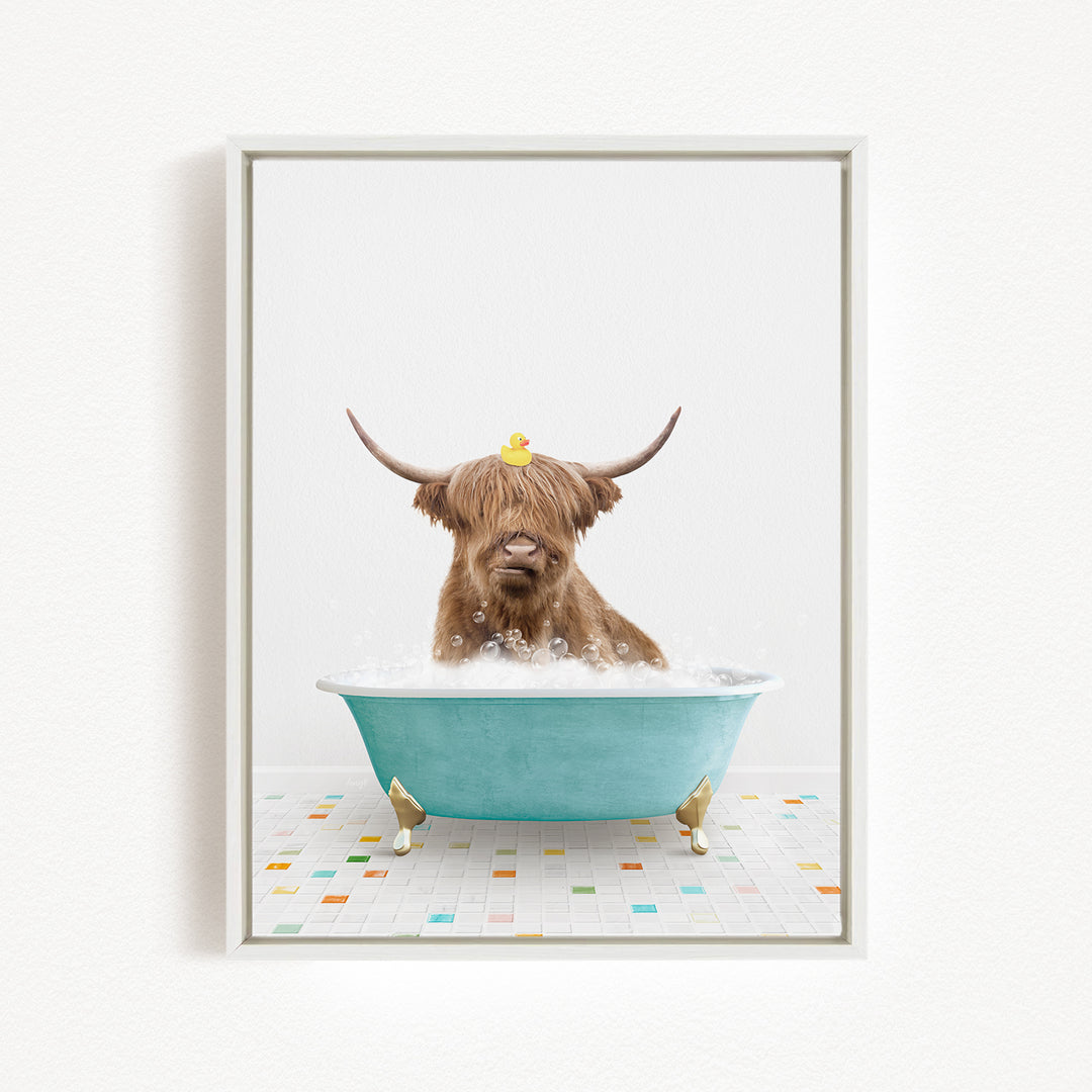 A Highland cow with large horns is sitting in a blue bathtub filled with bubbles, with a rubber duck perched on its head.