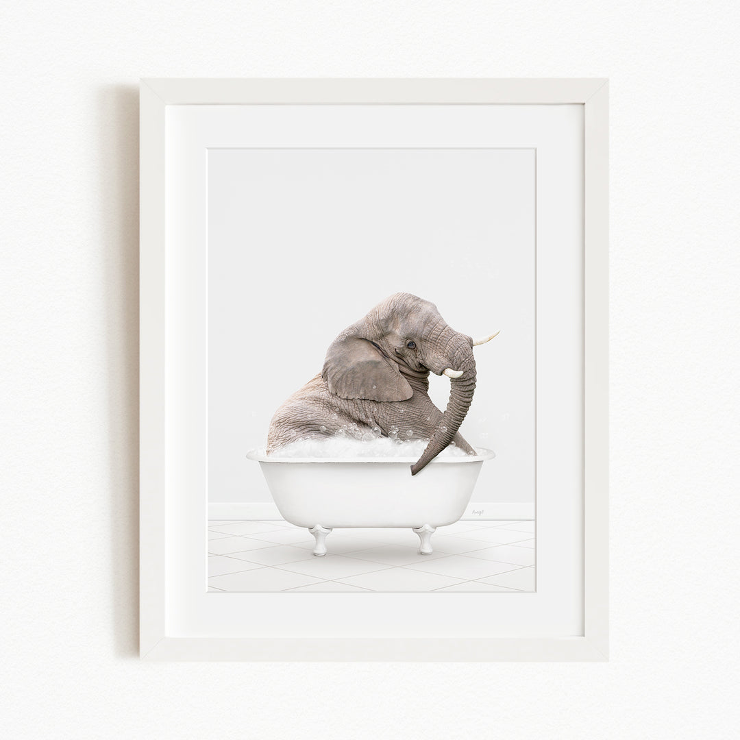 A gray elephant sitting in a white bathtub filled with water, with its trunk raised.