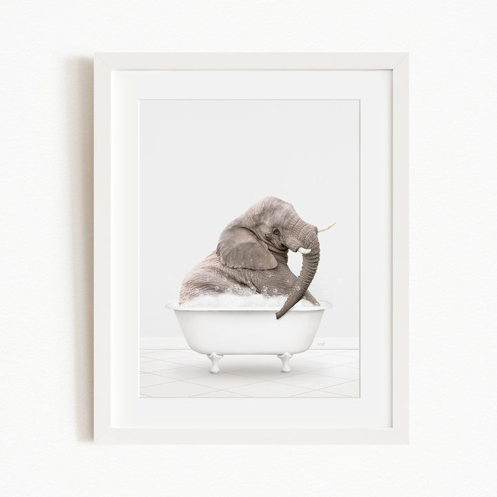 A gray elephant sitting in a white bathtub filled with water, with its trunk raised.