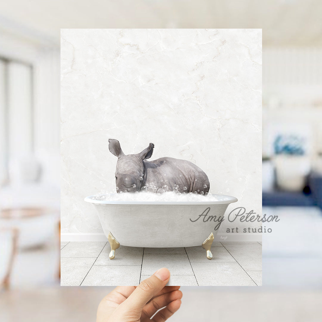 a rhinoceros sitting in a bathtub with foam on it