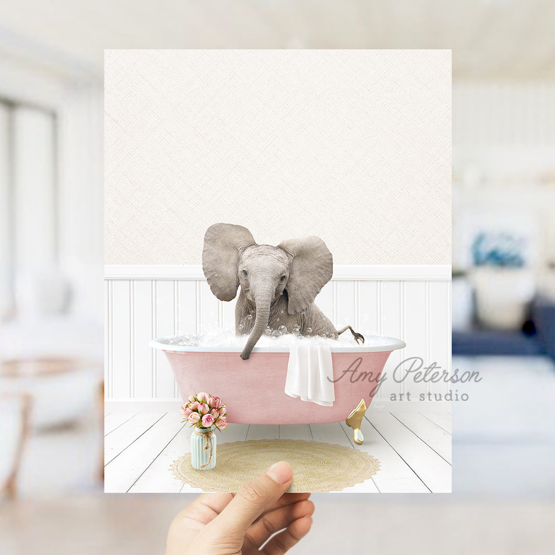 a person holding up a card with an elephant in a bathtub