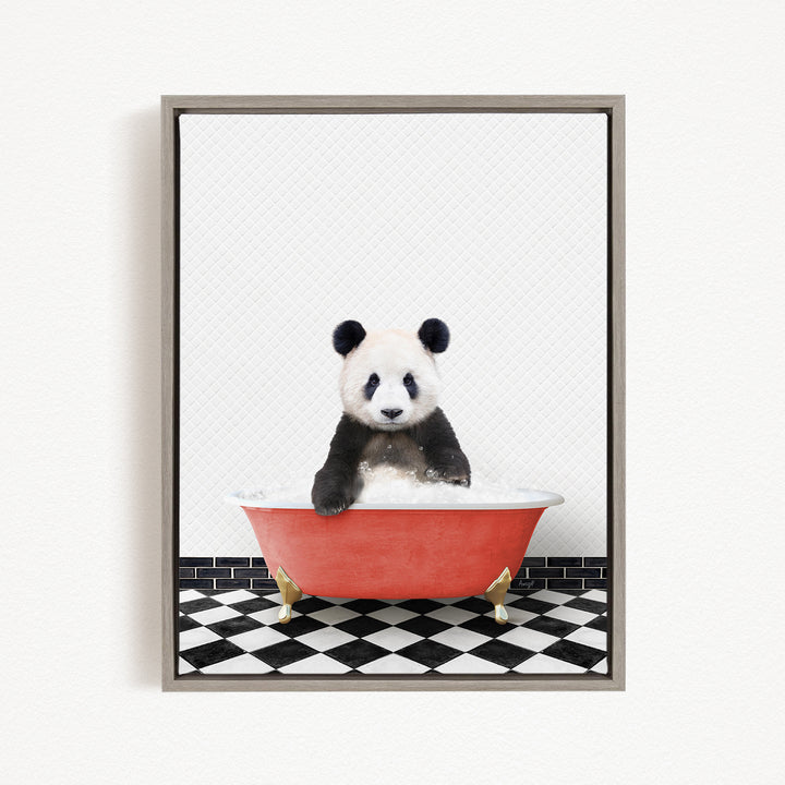 A panda bear sitting in a red bathtub on a black and white checkered floor.