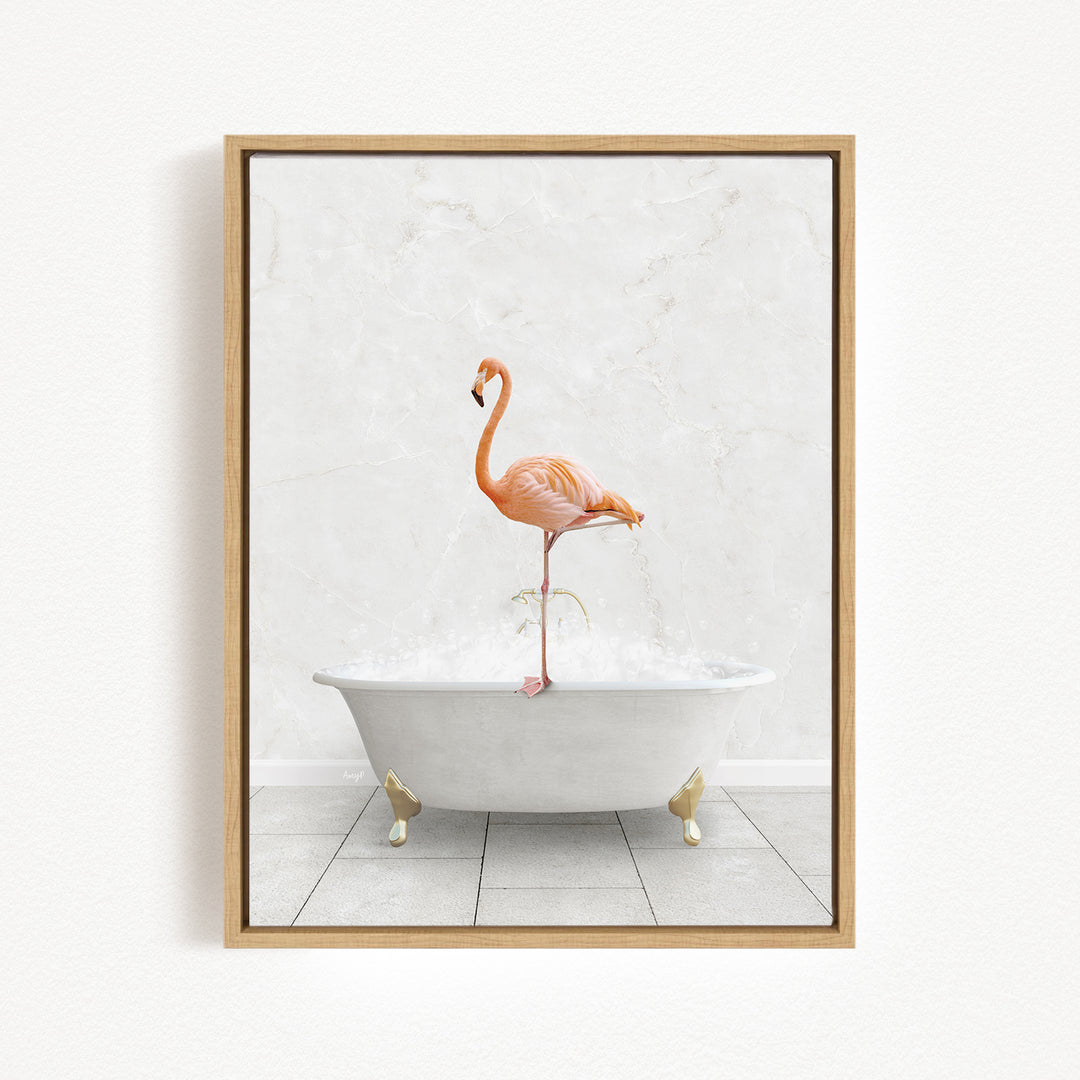 A framed image depicting a pink flamingo standing on a white bathtub filled with bubbles.