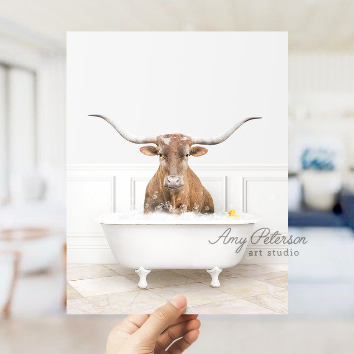 a person holding up a card with a picture of a cow in a bathtub