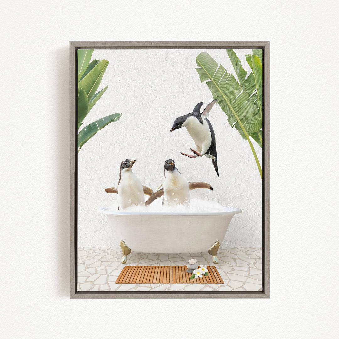 A framed image depicting two penguins sitting in a bathtub, surrounded by tropical plants and flowers.