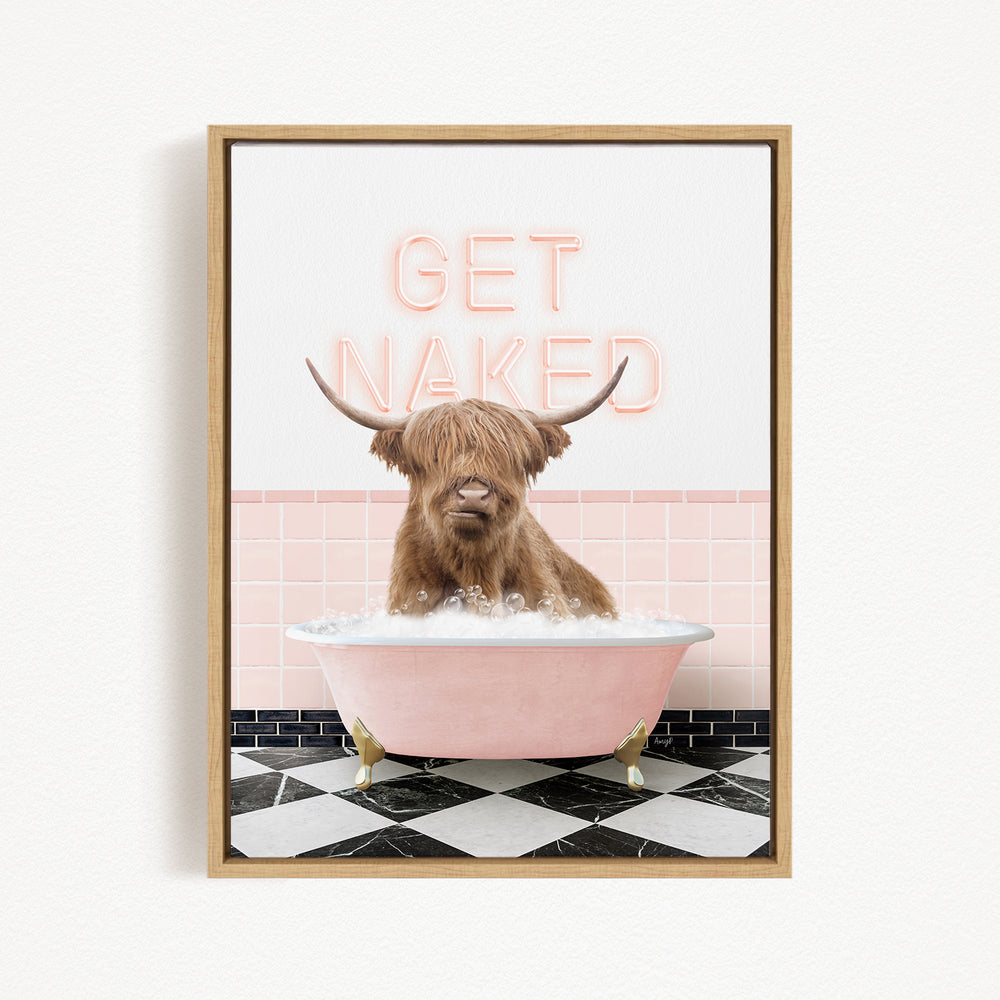 A framed image depicting a Highland cow sitting in a pink bathtub, with the text "GET NAKED" displayed above it.
