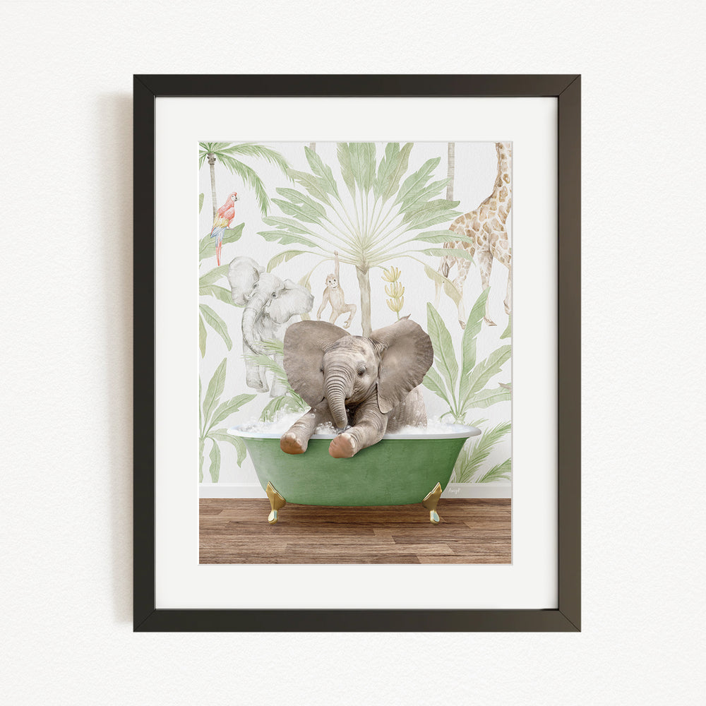 A framed illustration of a baby elephant sitting in a green bathtub, surrounded by a tropical jungle scene with various animals such as giraffes and elephants.