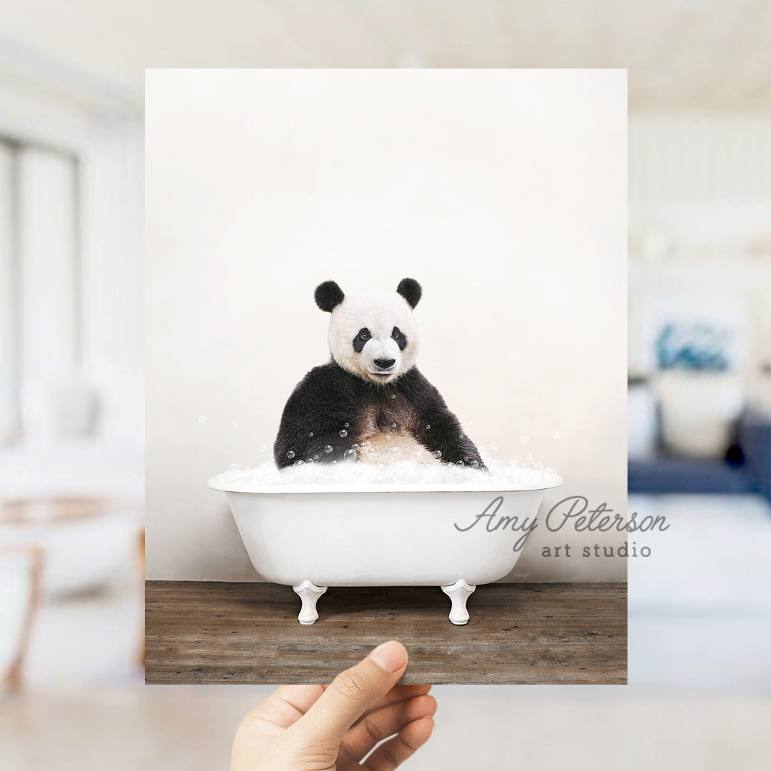 a panda bear sitting in a bath tub