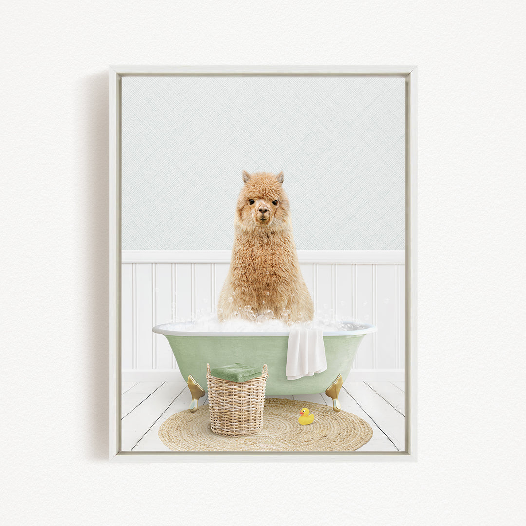 A fluffy alpaca sitting in a green bathtub filled with bubbles, surrounded by a yellow rubber duck and a woven basket.