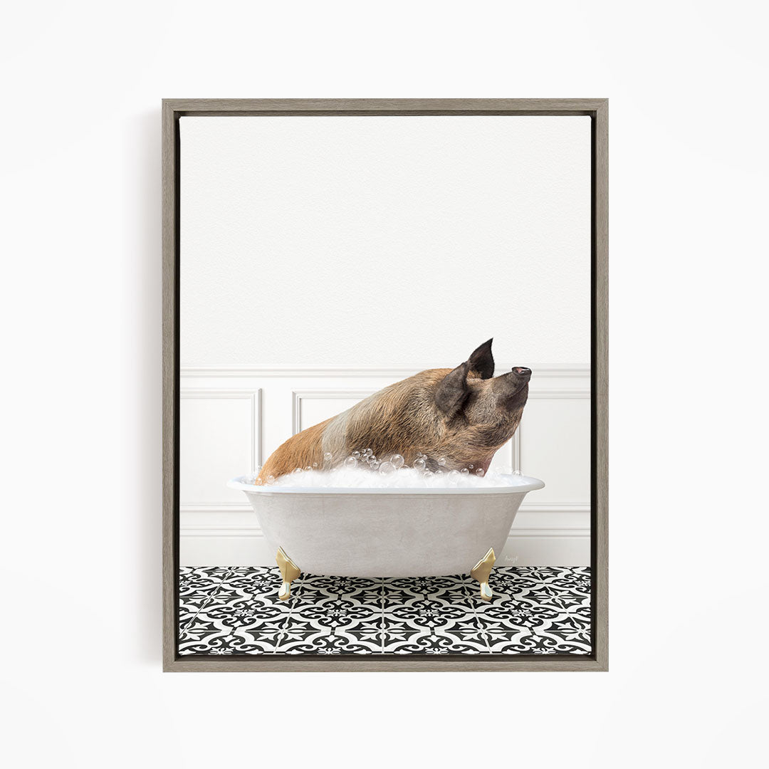 A brown pig sitting in a white bathtub filled with bubbles, looking up at the camera.