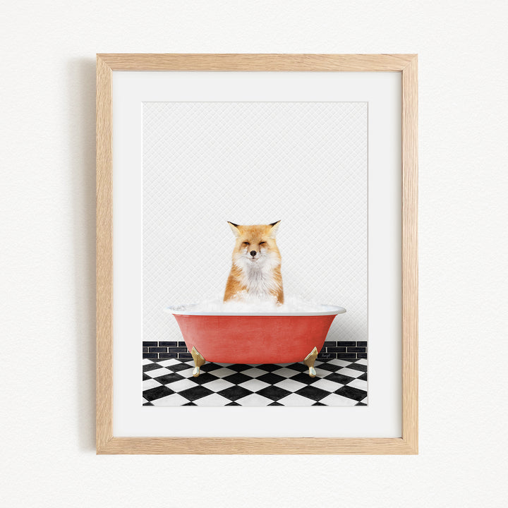 A red bathtub filled with water, with a fox sitting inside and looking at the camera.