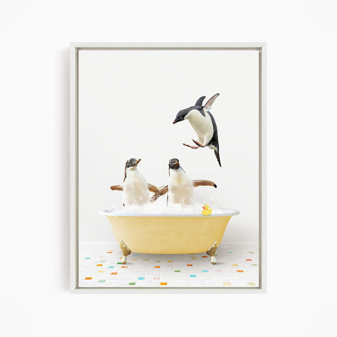 A framed image depicting two penguins sitting in a yellow bathtub, with one penguin flying towards the other penguin.