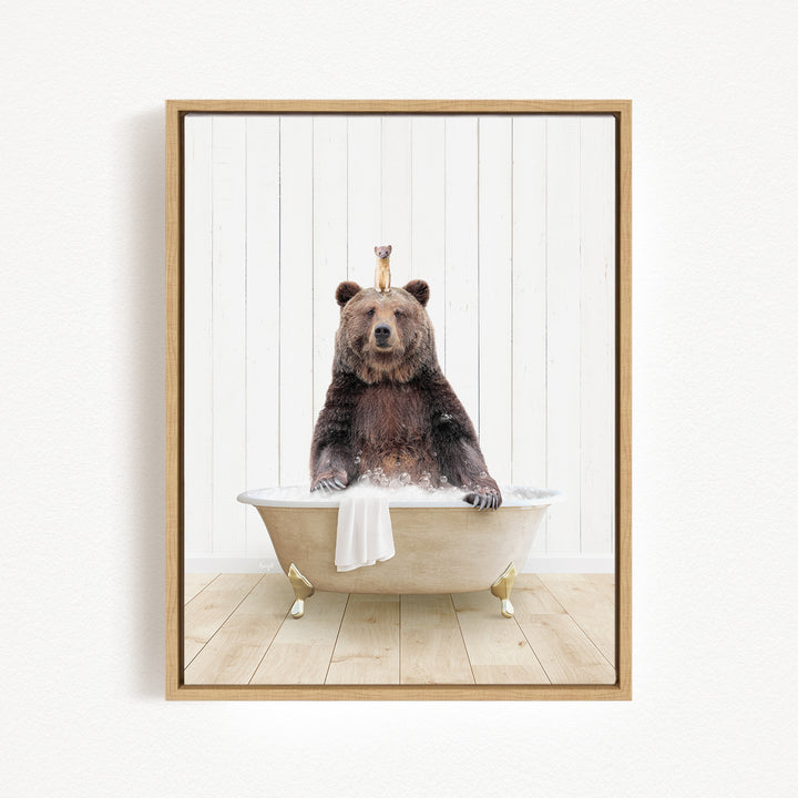 A brown bear sitting in a bathtub, with a small animal perched on its head.