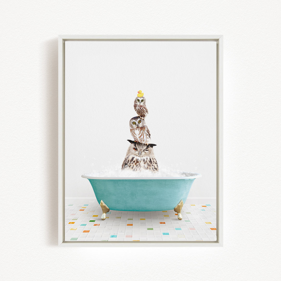 A framed image depicting a group of owls sitting in a bathtub filled with bubbles, creating a whimsical and playful scene.