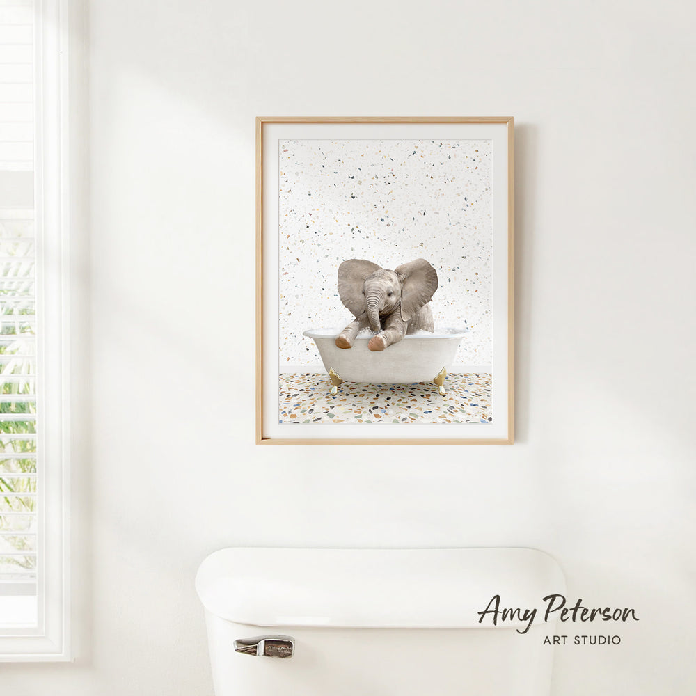 A framed image of two elephants sitting in a bathtub, with a text overlay that reads " Amy Peterson ART STUDIO".