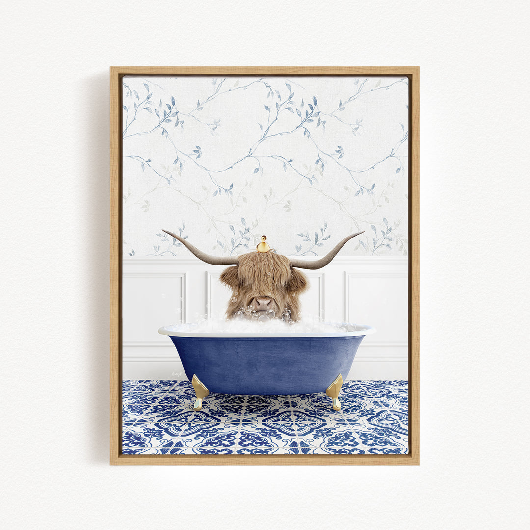 A brown cow with large horns is sitting in a blue bathtub filled with water, with a yellow bird perched on its head.