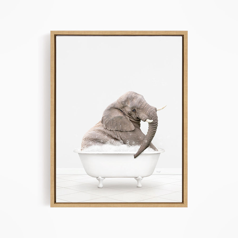 A gray elephant sitting in a white bathtub filled with bubbles, creating a whimsical and playful scene.