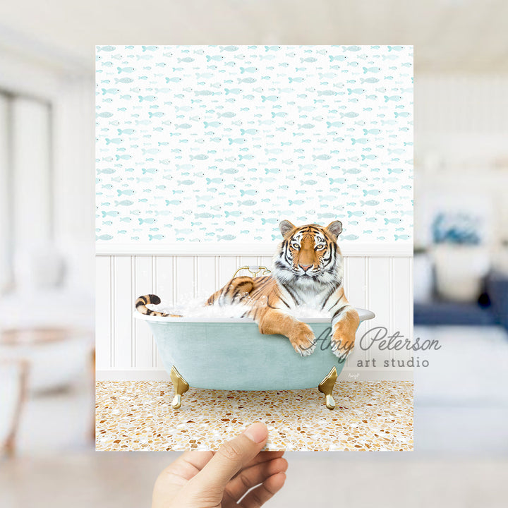 a hand holding a card with a picture of a tiger in a bathtub