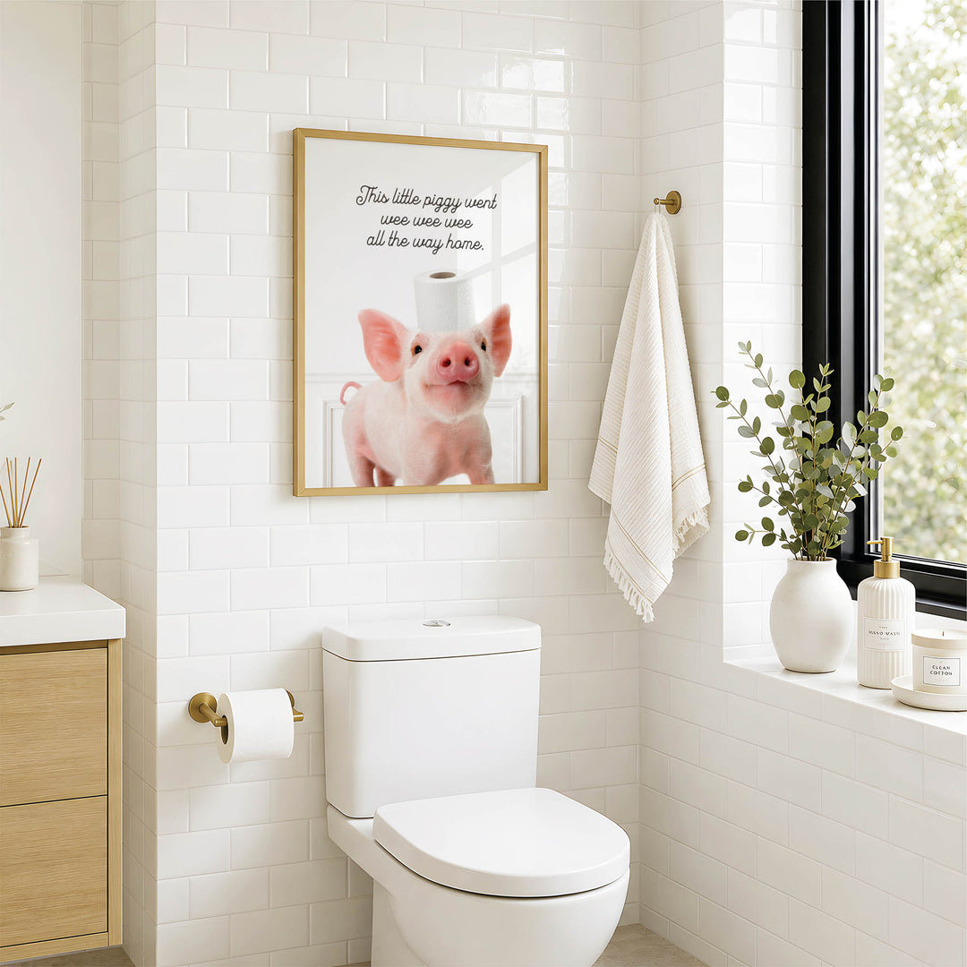 a bathroom with a white toilet, a framed picture of a pig on the wall, and a window with a plant on the sill.