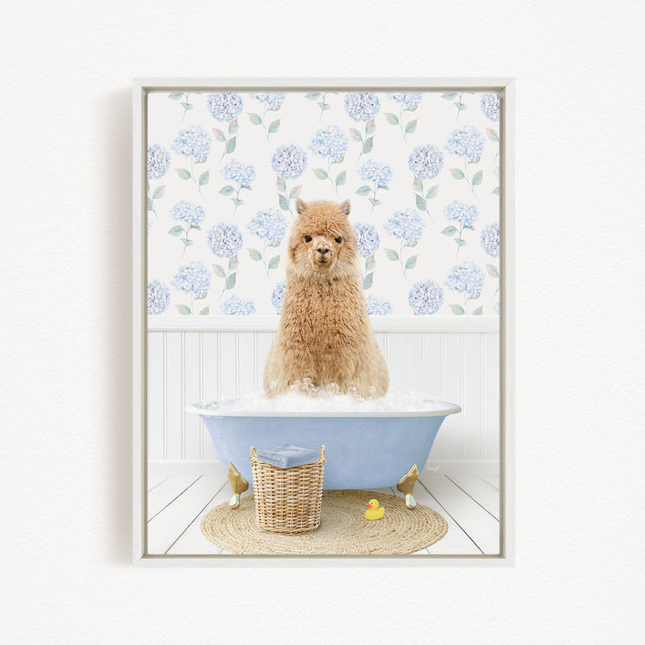 A fluffy brown dog sitting in a blue bathtub filled with bubbles, surrounded by a wicker basket, rubber duckies, and a floral patterned wall behind it.