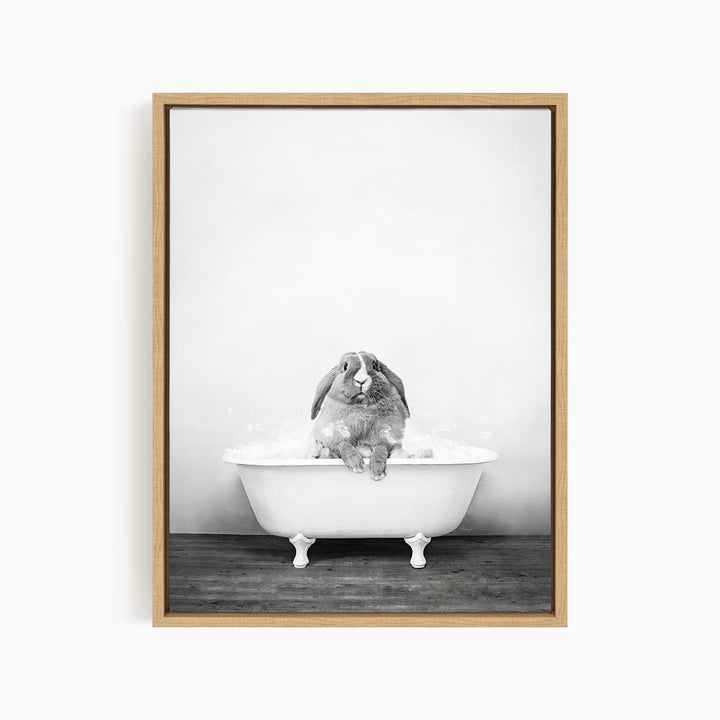 A rabbit sitting in a bathtub filled with water, enjoying a bath.