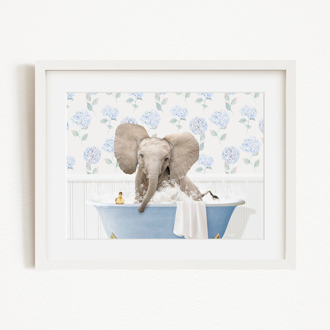 A baby elephant sitting in a blue bathtub, surrounded by a floral patterned wall.