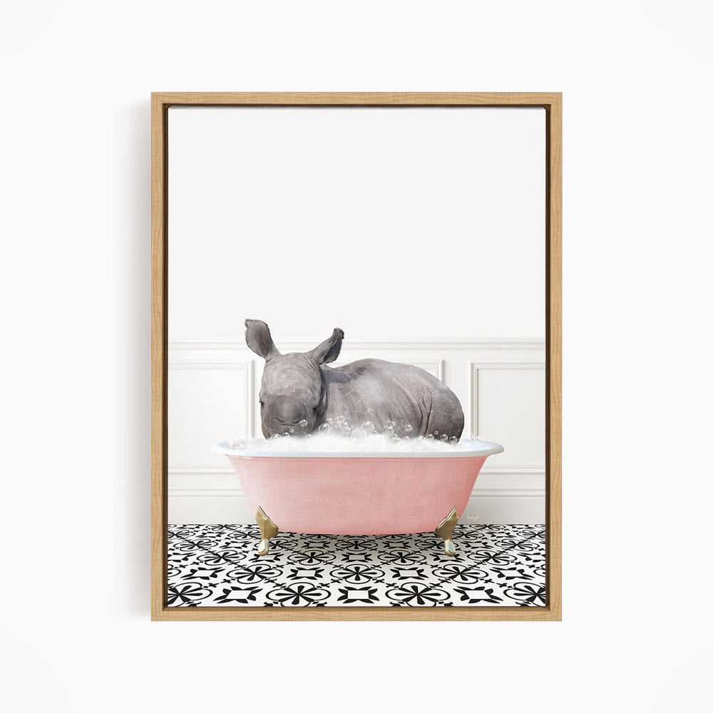 A rhinoceros is sitting in a pink bathtub filled with water, surrounded by a black and white patterned floor.