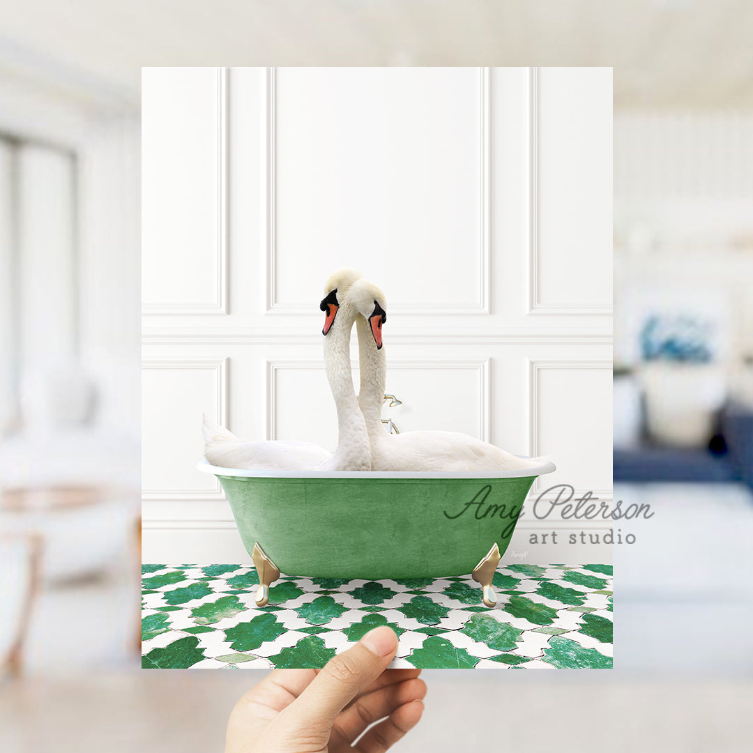 a person holding up a picture of a swan in a bathtub