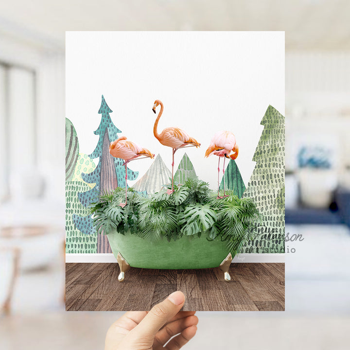 a person holding up a card with flamingos in a planter