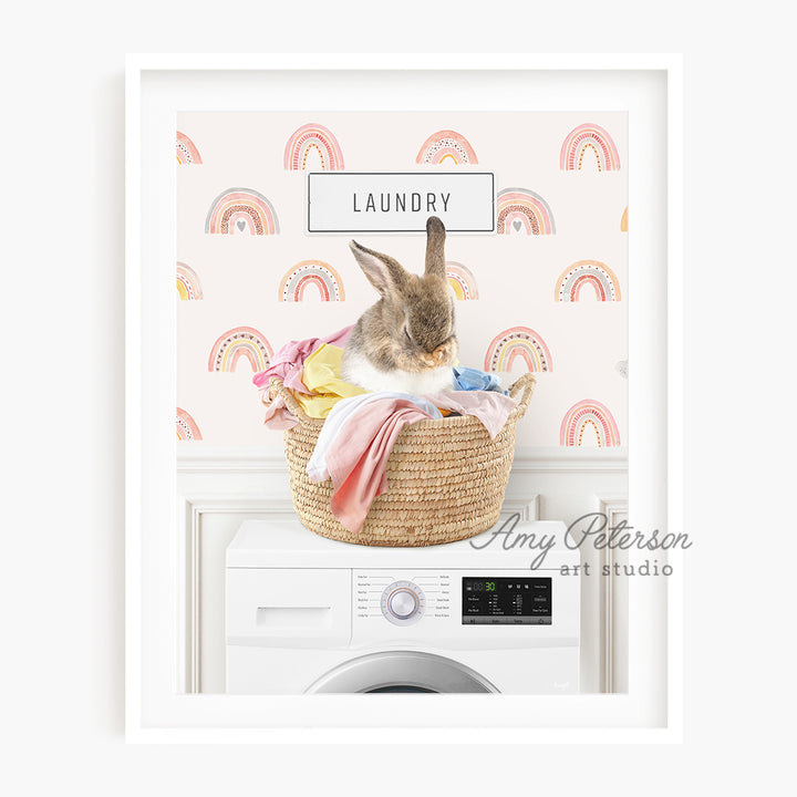 a bunny sitting in a laundry basket on top of a washing machine