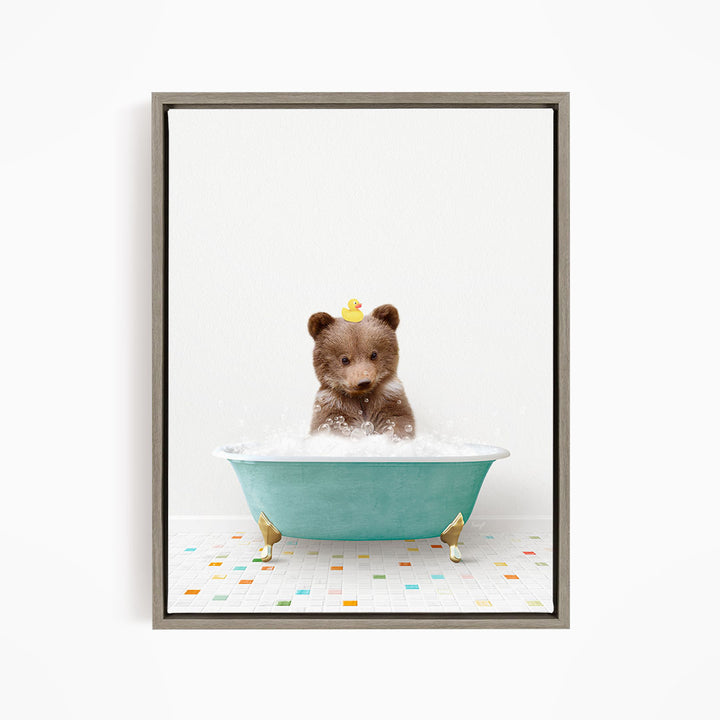A cute brown bear sitting in a blue bathtub filled with bubbles, with a yellow rubber duck floating on its head.