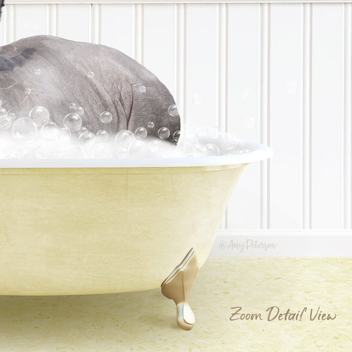 A bathtub filled with bubbles, with a gray elephant partially submerged in the water.