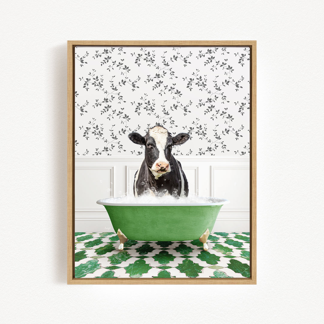 A black and white cow is sitting in a green bathtub filled with water, surrounded by a patterned wall and green and white floor tiles.