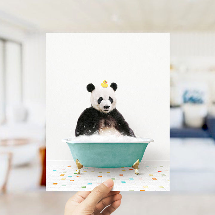 A panda bear sitting in a green bathtub filled with bubbles, with a rubber duck on its head.