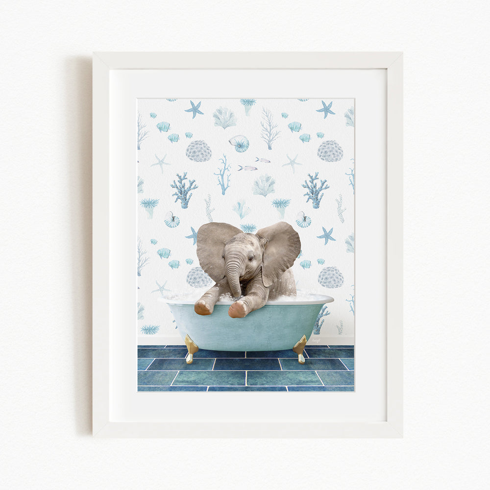A baby elephant sitting in a bathtub filled with water, surrounded by blue and white seashells and starfish on the wall behind it.