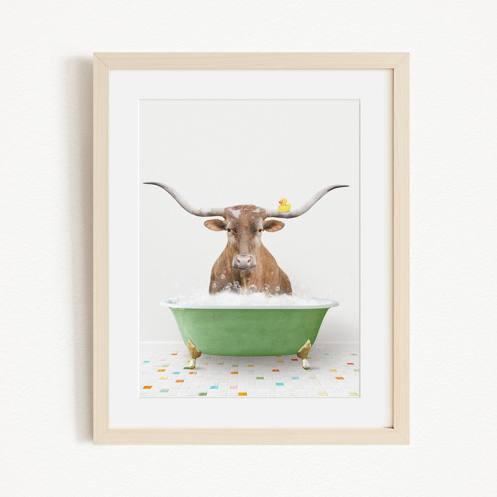 A brown cow with large horns is sitting in a green bathtub, surrounded by small yellow birds.