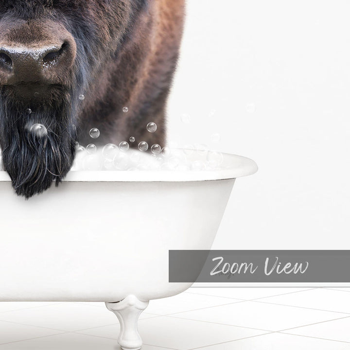 A close-up of a dog's face in a white bathtub filled with bubbles, with the word "Zoom View" written below the image.