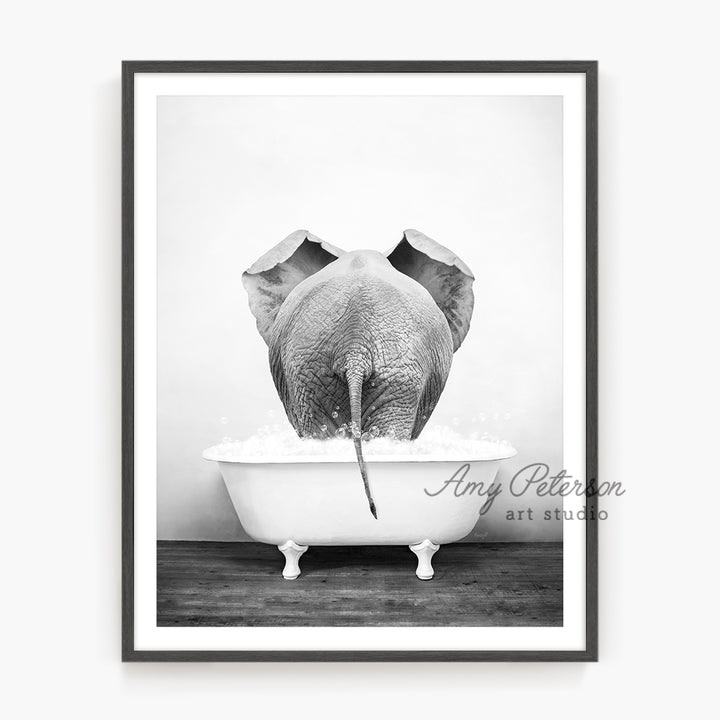 a black and white photo of an elephant in a bathtub