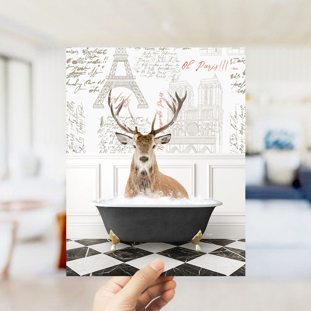 A deer with antlers is sitting in a bathtub filled with water, surrounded by a Paris-themed background with the Eiffel Tower and other landmarks.