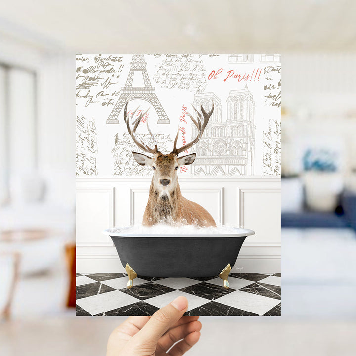 A deer with antlers is sitting in a bathtub filled with water, surrounded by a Paris-themed background with the Eiffel Tower and other landmarks.