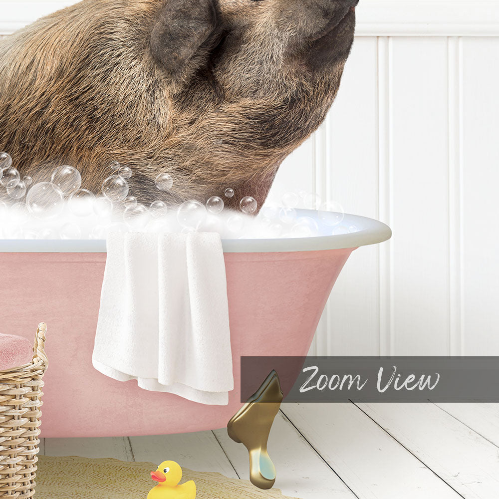 A pig is sitting in a pink bathtub filled with bubbles, surrounded by a yellow rubber duck and a white towel.