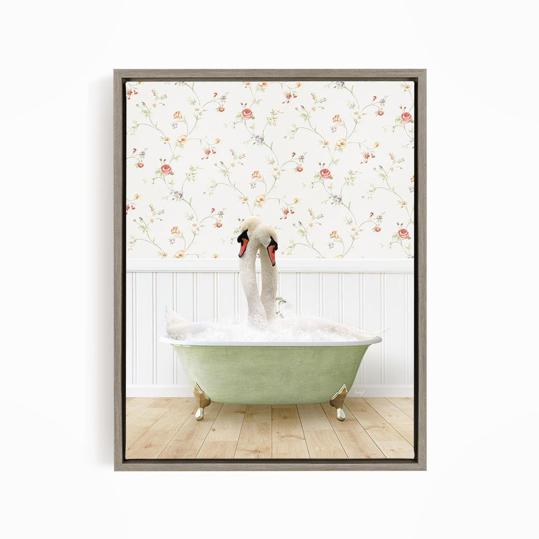 A pair of swans sitting in a green bathtub, with a floral wallpaper in the background.